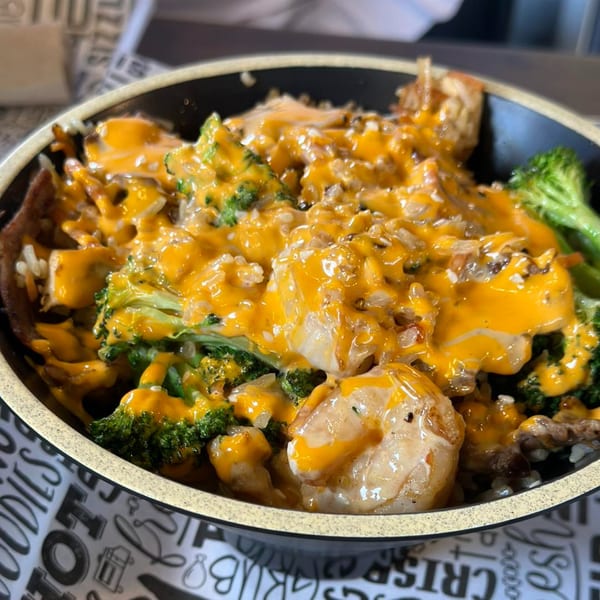 Itokos Grill's Japanese bowl with shrimp, broccoli, rice, and a generous drizzle of orange sauce.